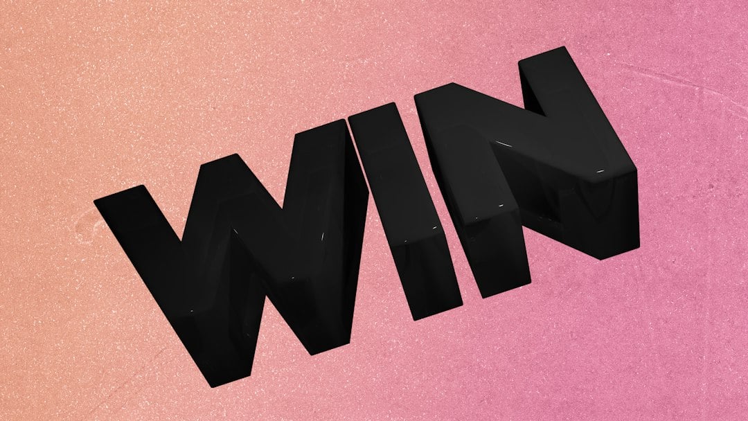 Bold black letters spell out "win"win"" on a textured background